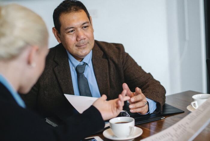 Meet to discuss selling a property portfolio Discussing selling property portfolio