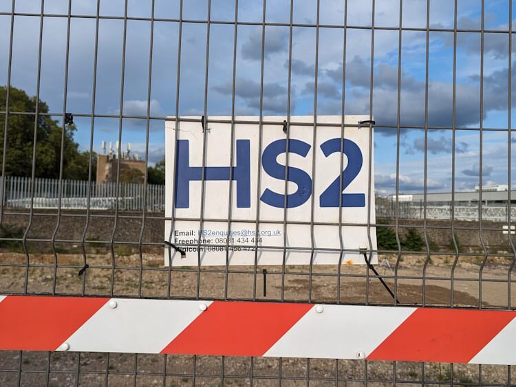 Houses near HS2 train line in countryside Houses near HS2 train line